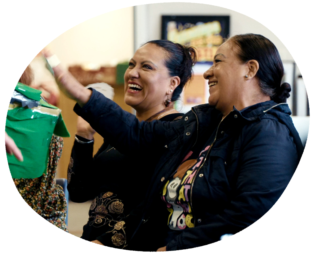 Photo of two women smiling. Photos by Faith Action: https://www.faithaction.net.