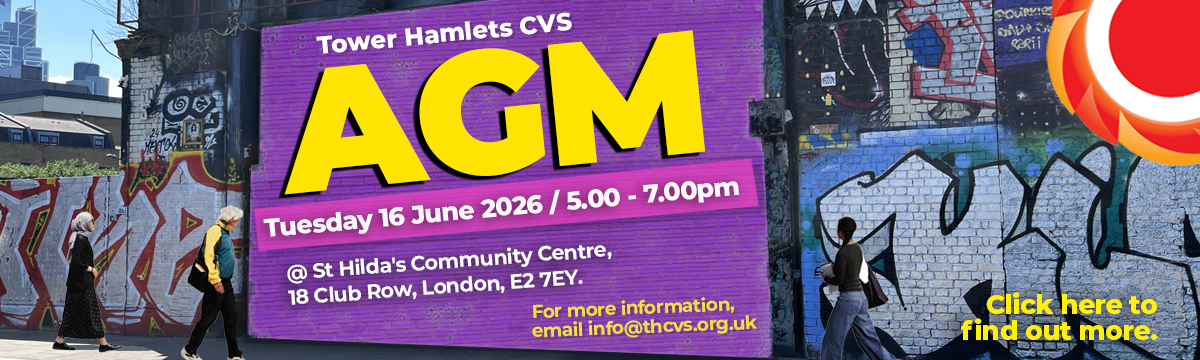 Photograph of 3 people walking down Brick Lane in Tower Hamlets. There is graffiti and a large purple billboard with large bright yellow text reads "AGM" - Tower Hamlets CVS AGM - Tuesday 16 June / 5.00 - 7.00pm at St. Hilda's Community Center, 18 Club Row, London, E2 7EY. For more information, email info@thcvs.org.uk. THCVS logo in the top right corner. Click here to find out more.