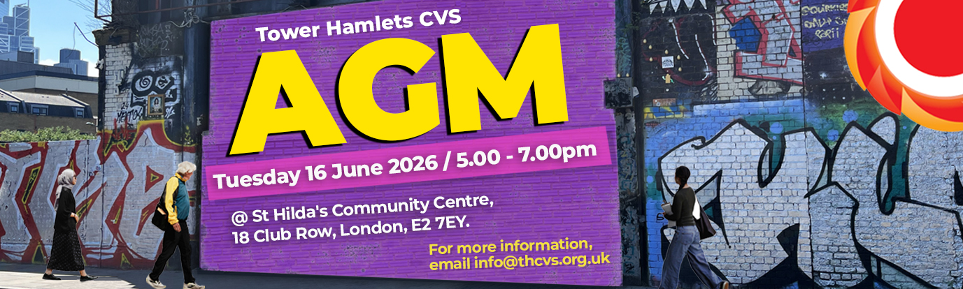 Photograph of 3 people walking down Brick Lane in Tower Hamlets. There is graffiti and a large purple billboard with big bright yellow text reads "AGM" - Tower Hamlets CVS AGM - Tuesday 16 June / 5.00 - 7.00pm at St. Hilda's Community Center, 18 Club Row, London, E2 7EY. For more information, email info@thcvs.org.uk. THCVS logo in the top right corner. Click here to find out more.